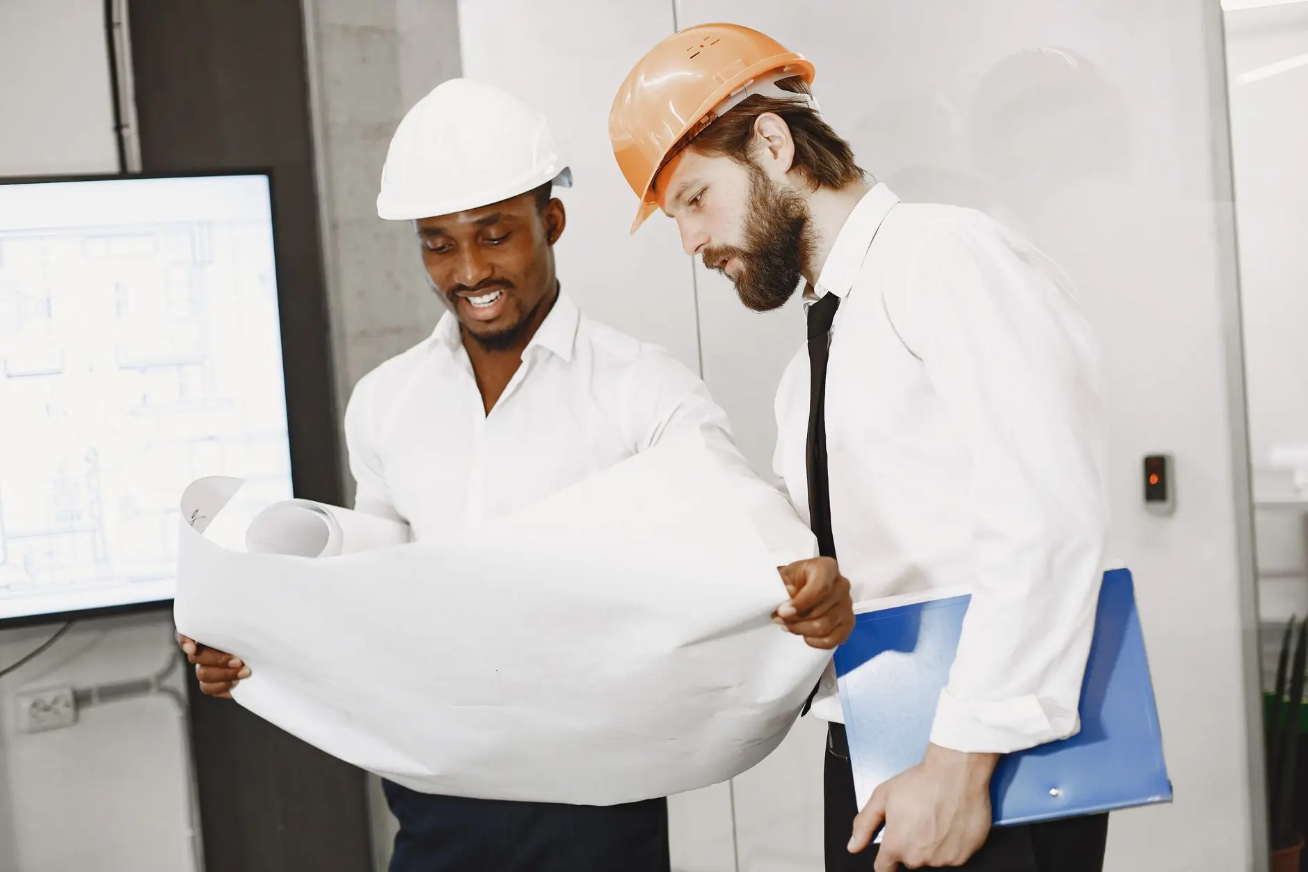 Engineers reviewing a project drawing